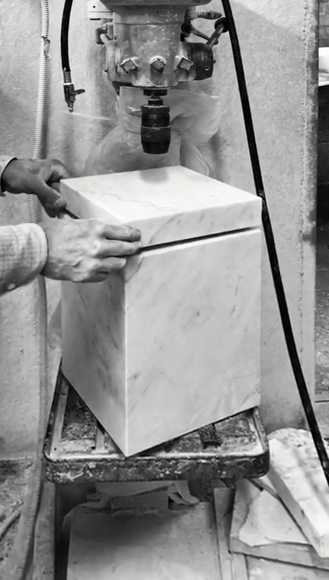 An artisan working a block of marble