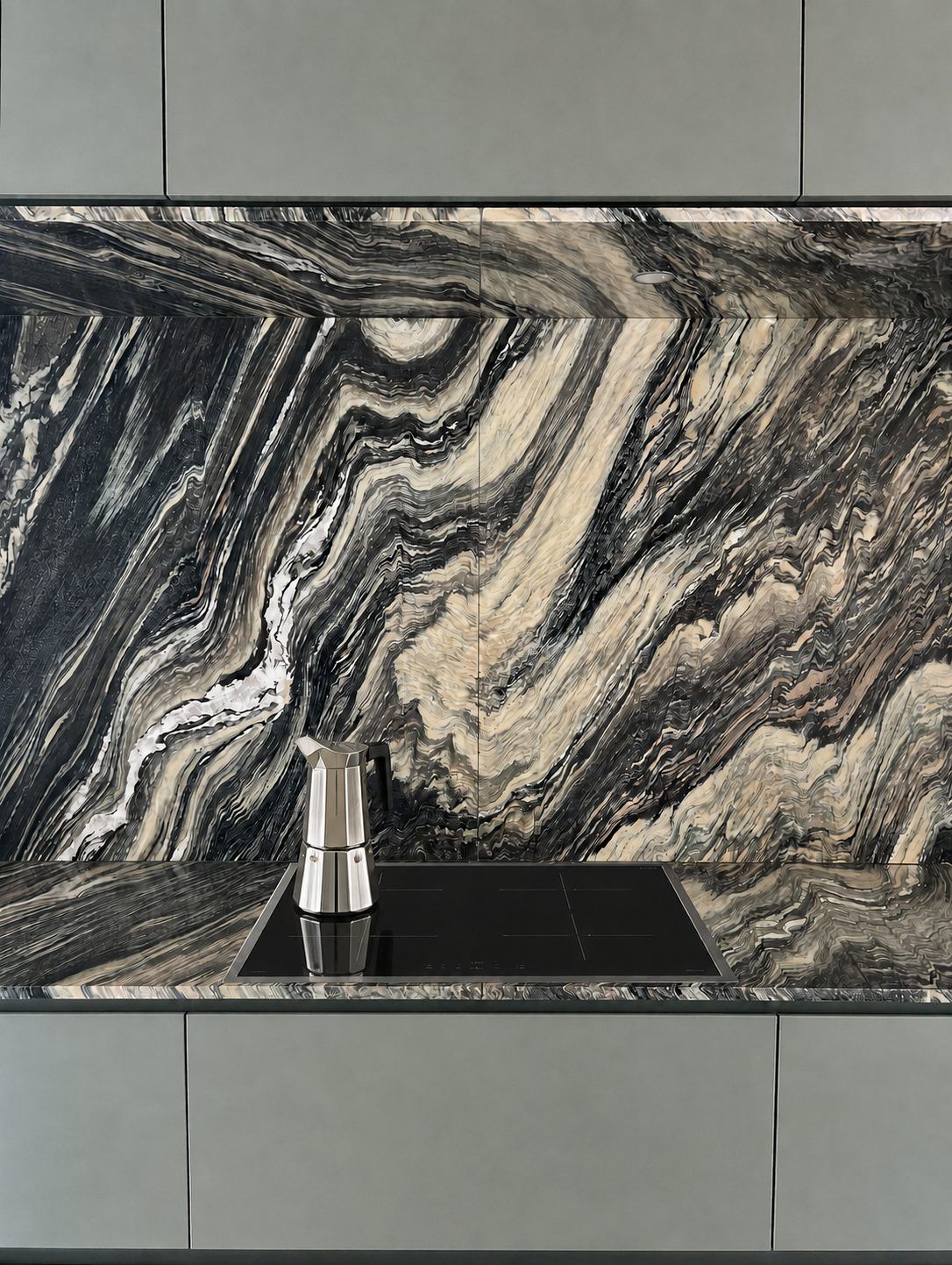 A kitchen wall and worktop in dramatic grey-black marble