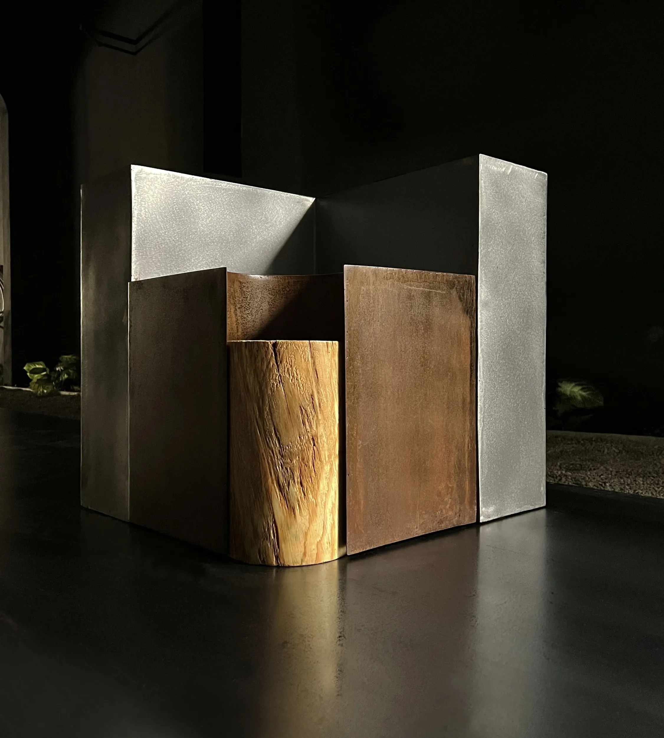 A Chimera bedside table assembled, in steel, wood and oxidised iron