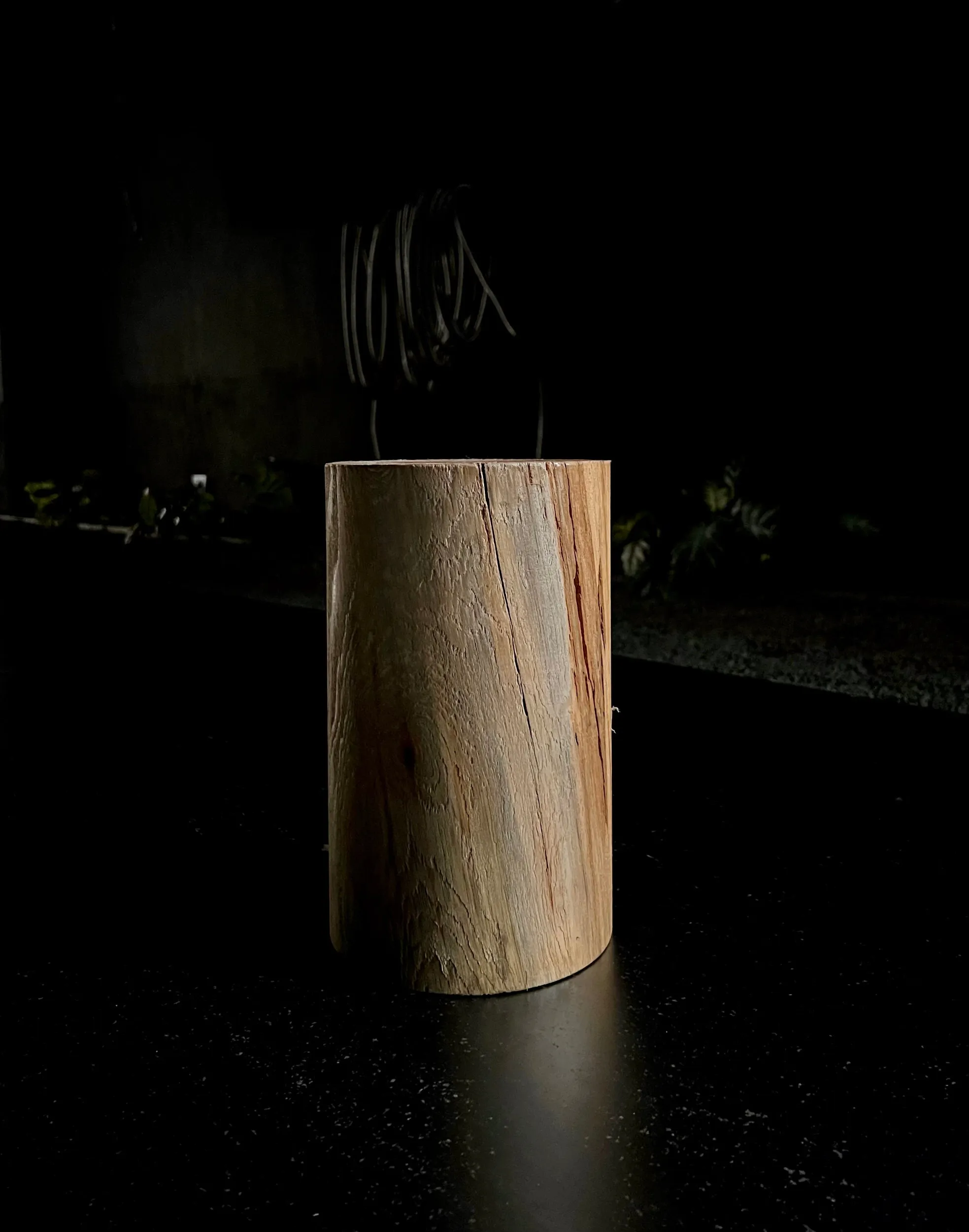 The block of wood a Chimera bedside table is built around