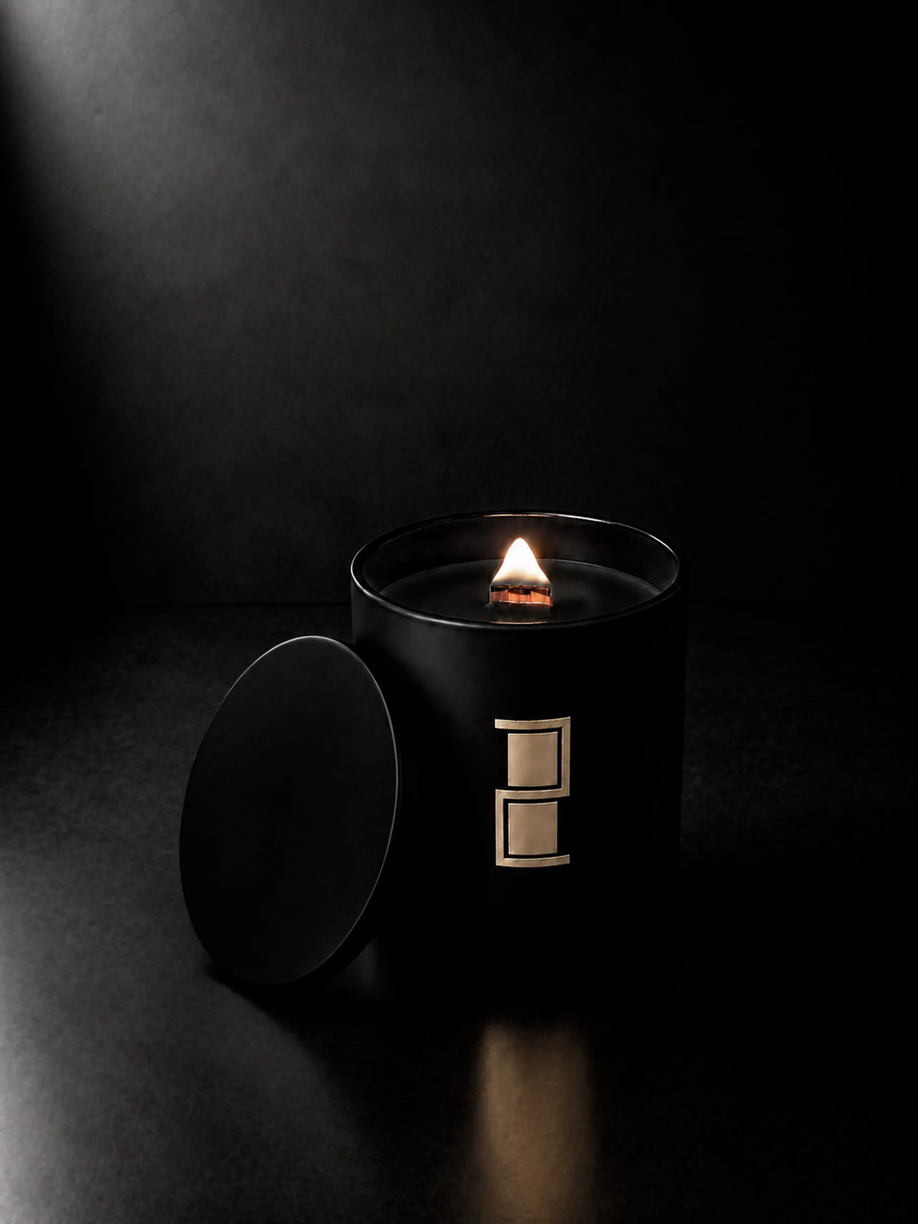 Ghibellina — the candle burning, its lid resting against the jar